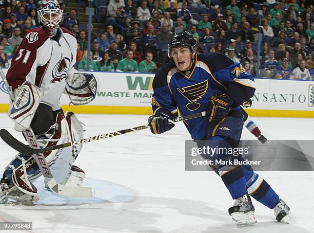 Oshie of the St. Louis Blues skates past Peter Budaj of the Colorado Avalanche on March 16, 2010 at Scottrade Center in St. Louis, Missouri.