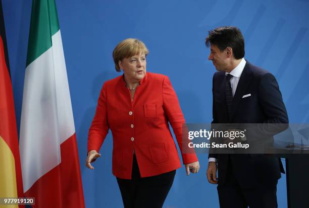 German Chancellor Angela Merkel and Italian Prime Minister Guiseppe Conte depart for bilateral talks after giving statements to the media at the...