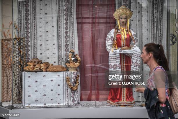 Woman walks in front of a Russian traditional backery in Kaliningrad on June 18, 2018 during the Russia 2018 FIFA World Cup football tournament.