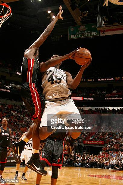 DeJuan Blair of the San Antonio Spurs shoots against Joel Anthony of the Miami Heat on March 16, 2010 at American Airlines Arena in Miami, Florida....
