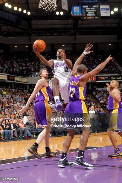 Tyreke Evans of the Sacramento Kings takes the ball to the basket against Ron Artest of the Los Angeles Lakers on March 16, 2010 at ARCO Arena in...