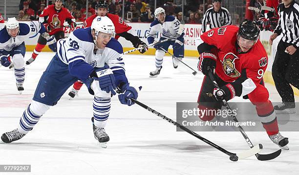 Milan Michalek of the Ottawa Senators stickhandles the puck against Carl Gunnarsson of the Toronto Maple Leafs at Scotiabank Place on March 16, 2010...