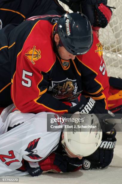 Brooks Laich of the Washington Capitals is pushed down into the ice after scoring a goal by Bryan Allen of the Florida Panthers at the BankAtlantic...