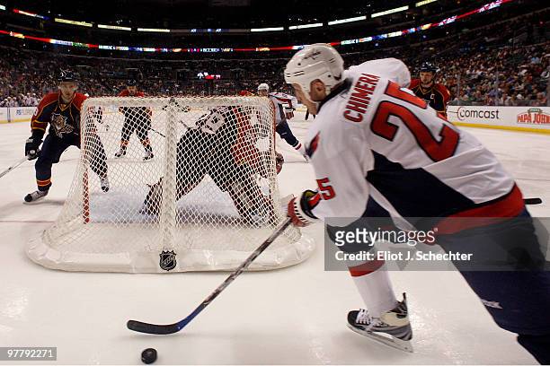 Jason Chimera of the Washington Capitals skates with the puck behind the net against the Florida Panthers at the BankAtlantic Center on March 16,...