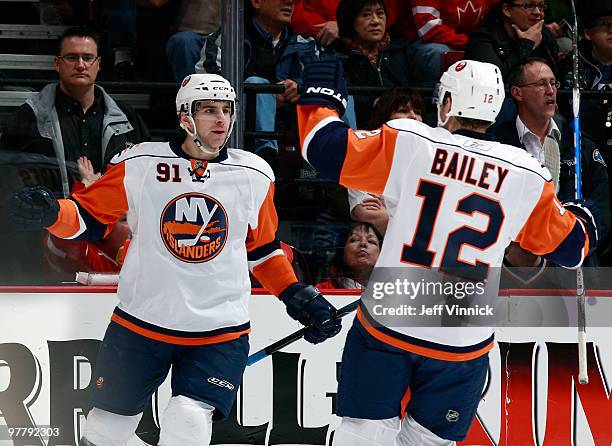 John Tavares of the New York Islanders celebrates his goal with teammate Josh Bailey during their game against the Vancouver Canucks at General...