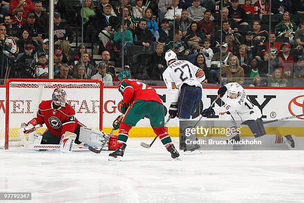 Ryan Potulny of the Edmonton Oilers scores a goal against Josh Harding and the Minnesota Wild during the game at the Xcel Energy Center on March 16,...