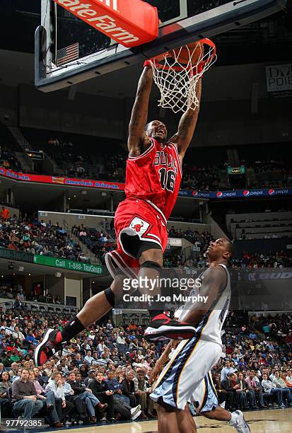 James Johnson of the Chicago Bulls dunks against Darrell Arthur of the Memphis Grizzlies on March 16, 2010 at FedExForum in Memphis, Tennessee. NOTE...