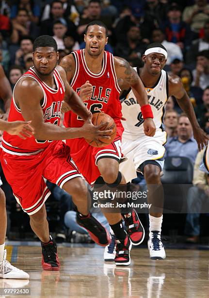 Devin Brown and James Johnson of the Chicago Bulls run up the floor with Ronnie Brewer of the Memphis Grizzlies on March 16, 2010 at FedExForum in...
