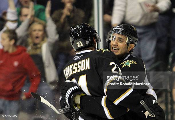 Mike Ribeiro of the Dallas Stars celebrates his goal with Loui Eriksson against the San Jose Sharks at American Airlines Center on March 16, 2010 in...