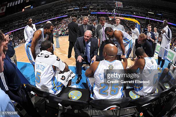 Head coach George Karl of the Denver Nuggets talks with his team during a time out against the Washington Wizards on March 16, 2010 at the Pepsi...
