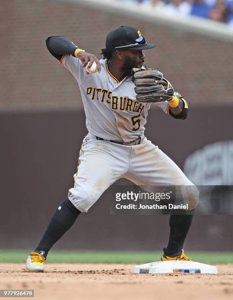 Josh Harrison of the Pittsburgh Pirates throws to first base against the Chicago Cubs at Wrigley Field on June 8, 2018 in Chicago, Illinois. The Cubs...