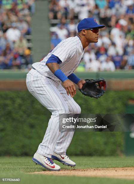 Addison Russell of the Chicago Cubs awaits the pitch against the Pittsburgh Pirates at Wrigley Field on June 8, 2018 in Chicago, Illinois. The Cubs...