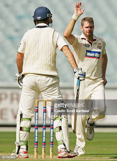Chris Swan of the Bulls celebrates after dismissing Rob Quiney of the Bushrangers during day one of the Sheffield Shield Final between the Victorian...