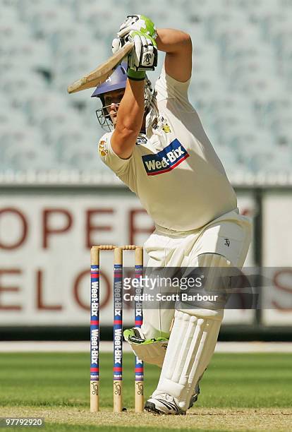Aaron Finch of the Bushrangers plays a shot during day one of the Sheffield Shield Final between the Victorian Bushrangers and the Queensland Bulls...