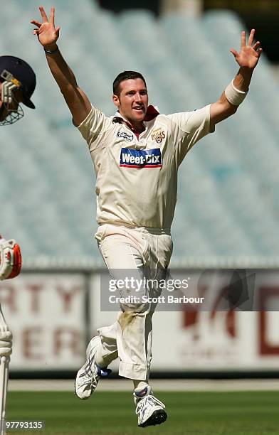 Luke Feldman of the Bulls celebrates after dismissing Andrew McDonald of the Bushrangers during day one of the Sheffield Shield Final between the...