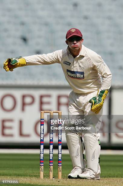 Wicketkeeper Chris Hartley of the Bulls takes a return throw from the outfield during day one of the Sheffield Shield Final between the Victorian...
