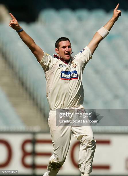 Luke Feldman of the Bulls celebrates after dismissing Andrew McDonald of the Bushrangers during day one of the Sheffield Shield Final between the...