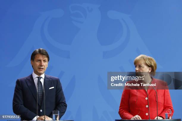German Chancellor Angela Merkel and Italian Prime Minister Giuseppe Conte address the media upon's Conte's arrival at the Chancellery on June 18,...