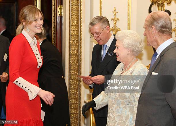 Queen Elizabeth II and Prince Philip, Duke of Edinburgh meet Sophie Dahl at a reception for the British Clothing Industry, including an exhibition of...