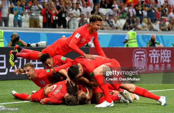 Harry Kane of England celebrates after scoring his team's first goal with team mates during the 2018 FIFA World Cup Russia group G match between...