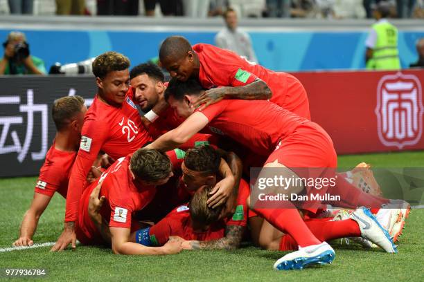 Harry Kane of England celebrates after scoring his team's first goal with team mates during the 2018 FIFA World Cup Russia group G match between...