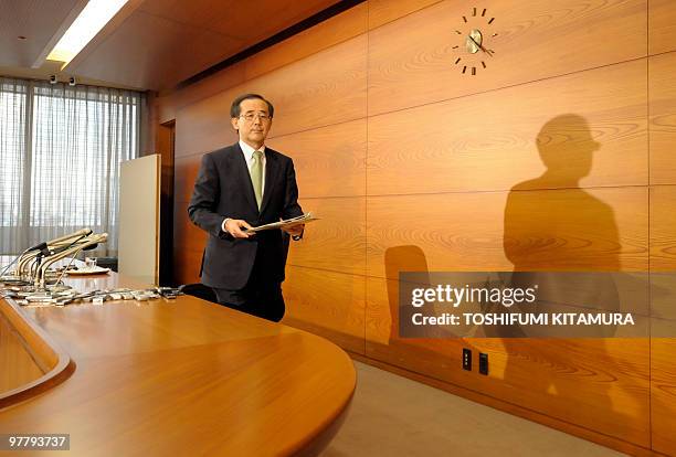 Governor Masaaki Shirakawa of the Bank of Japan leaves the room after his annual press conference at the BOJ headquarters in Tokyo on March 17, 2010....