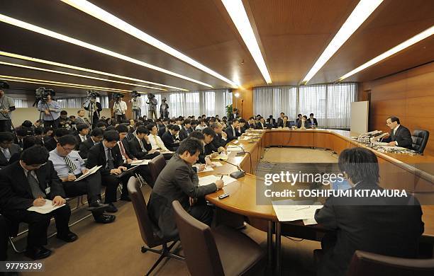 Governor Masaaki Shirakawa of the Bank of Japan delivers his speech during his annual press conference at the BOJ headquarters in Tokyo on March 17,...