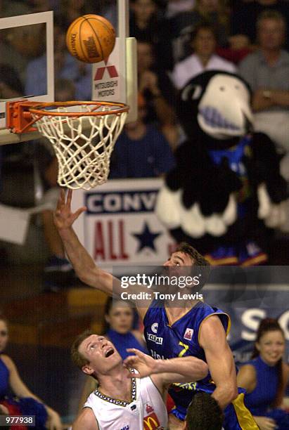 Mark Nash for Adelaide scores past Pat Reidy for Townsville in the match between the Adelaide 36ers and the Townsville Crocodiles played at the...