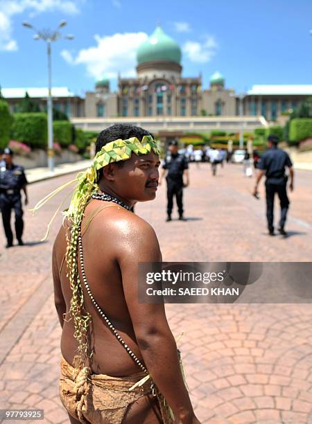 Member of a Malaysian indigenous tribe walks in front of the Prime Minister's office in Putrajaya during a protest on March 17, 2010. Some 500 Orang...
