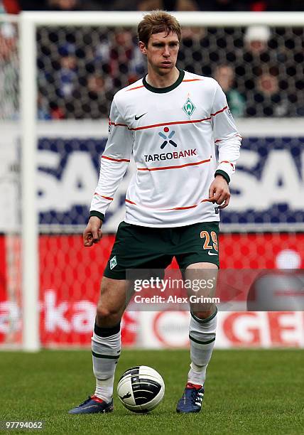 Per Mertesacker of Bremen runs with the ball during the Bundesliga match between 1899 Hoffenheim and Werder Bremen at the Rhein-Neckar Arena on March...