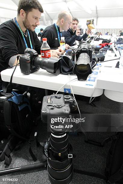 Photographers working in the Cypress Media Centre on Thursday, Feb. 25 during the Vancouver 2010 Olympic Winter Games. AFP PHOTO / STEPHANIE LAMY