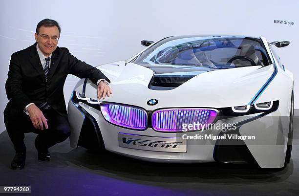 Chairman and CEO Norbert Reithofer poses next to the BMW Vision concept car during the annual news conference at BMW World on March 17, 2010 in...