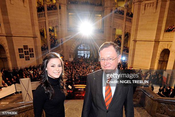 German Lena Meyer-Landrut poses next to Hanover's mayor Stephan Weil during a reception at the cityhall of Hanover, northern Germany on March 16,...