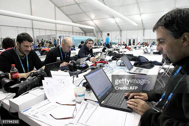 Photographers working in the Cypress Media Centre on February 25 during the Vancouver 2010 Olympic Winter Games. AFP PHOTO / STEPHANIE LAMY