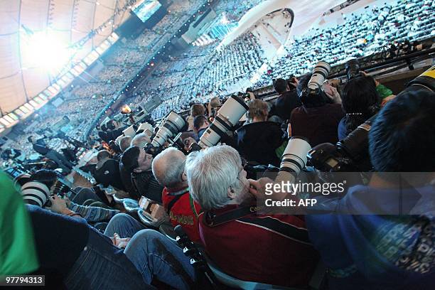 Photographers working during the Closing Ceremony in BC Stadium on February 28 during the Vancouver 2010 Olympic Winter Games. AFP PHOTO / STEPHANIE...