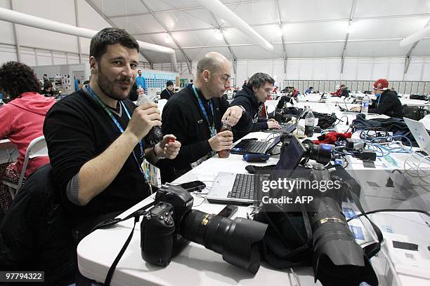 Photographers working in the Cypress Media Centre on Thursday, February 25 during the Vancouver 2010 Olympic Winter Games. AFP PHOTO / STEPHANIE LAMY