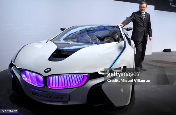 Chairman and CEO Norbert Reithofer poses next to the BMW Vision concept car during the annual news conference at BMW World on March 17, 2010 in...