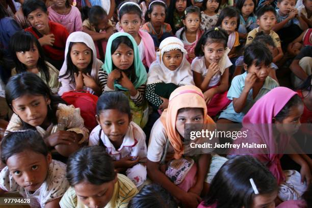 Children affected by the fighting between Philippine security forces and Muslim rebels are gathered together in one of the evacuation camps on March...