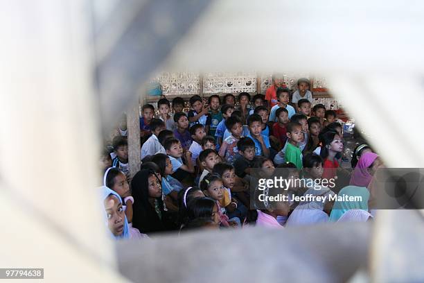 Children affected by the fighting between Philippine security forces and Muslim rebels are gathered together in an evacuation camp on March 17, 2010...