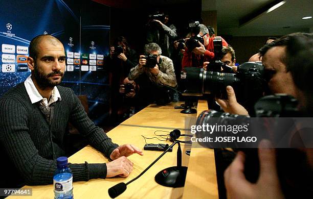 Barcelona's coach Pep Guardiola poses for photographers during a press conference at New Camp in Barcelona on March 16 on the eve of a UEFA Champions...