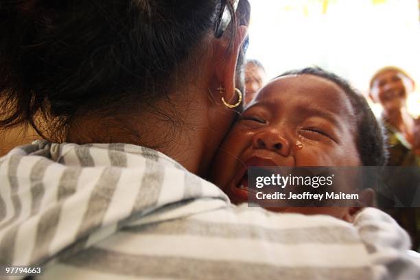 Muslim Philipino child cries at an evacuation camp on March 17, 2010 in Datu Anggal Midtimbang, Maguindanao Province, Philippines. UNICEF, working...