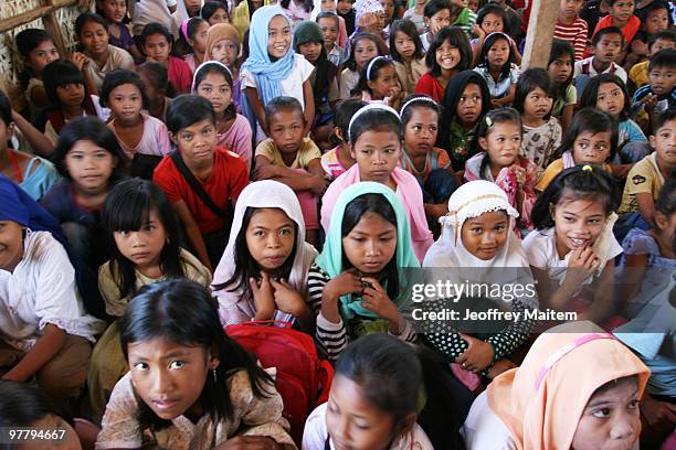 Children affected by the fighting between Philippine security forces and Muslim rebels are gathered together in one of the evacuation camps on March...