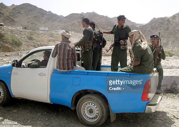 Yemeni security forces patrol a rugged area in the province of Abyan, south of Sanaa, on March 17, 2010. Yemen has beefed up security around oil and...