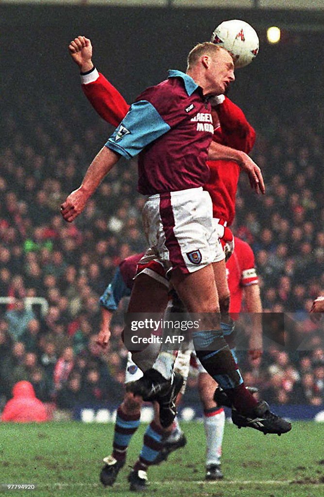 West Ham's Iain Dowie meets the ball as