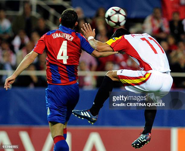 Sevilla's Brazilian midfielder Renato vies with CSKA Moscow's Russian defender Sergei Ignashevich during their UEFA Champions League football match...