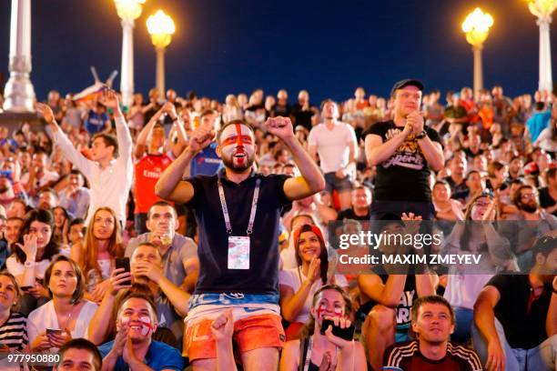 English fans at a Fan Fest celebrate their team's opener as they watch the Russia 2018 World Cup Group G football match between Tunisia and England...