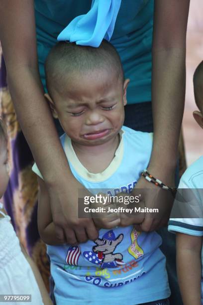 Filipino Muslim kid affected by the fighting between Philippine security forces and Muslim rebels is seen crying while undergoing psychological...