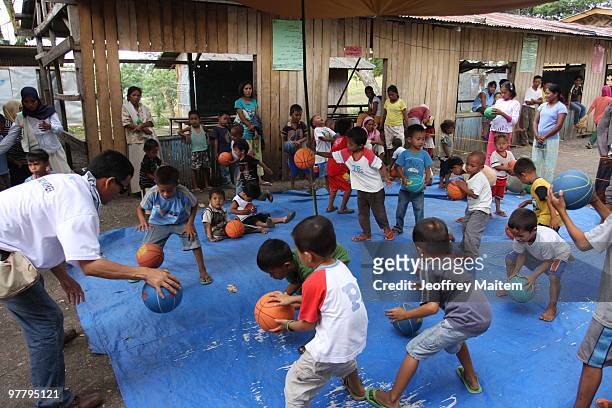 Filipino Muslim teenagers affected by the fighting kids ilippine security forces and Muslim rebels are seen playing after undergoing psychological...