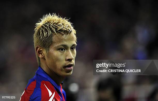 Moscow's Japanesse midfielder Keisuke Honda reacts during a UEFA Champions League football match against Sevilla on March 16, 2010 at Ramon Sanchez...