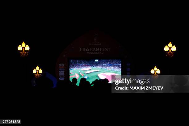 English fans in a Fan Fest watch the Russia 2018 World Cup Group G football match between Tunisia and England at the Volgograd Arena in Volgograd on...